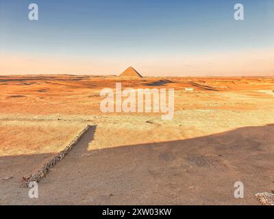 Magnificent view of the Red Pyramid of Snefuru in an other wordly martian-like desert scene as viewed from the entrance to the Bent Pyramid at the Dahshur necropolis near Cairo,Egypt Stock Photo