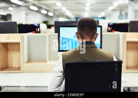 Back, creative and black man on computer screen in office for web design, information research and digital software. Male developer, pc and typing for Stock Photo