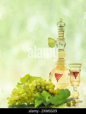 Still life with wine, vine and bunch of grapes Stock Photo - Alamy