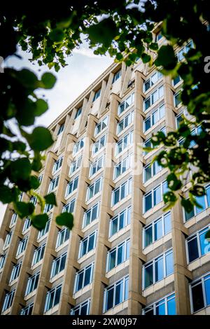 Antwerp, Belgium, August 16th 2024: Low angle view on burtalist Oudaan tower (politietoren) by architect Renaat Braem in Antwerp Stock Photo