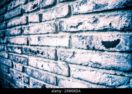 Rough surface of a brick wall with visible textures and colors, ideal for use in design, backgrounds, and artistic projects requiring a rustic or urba Stock Photo