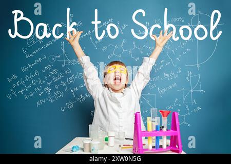 Adorable Schoolgirl cute little girl on blue background. Back to school concept Stock Photo