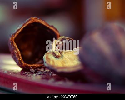 Close-up of broken walnut shells on a table Stock Photo