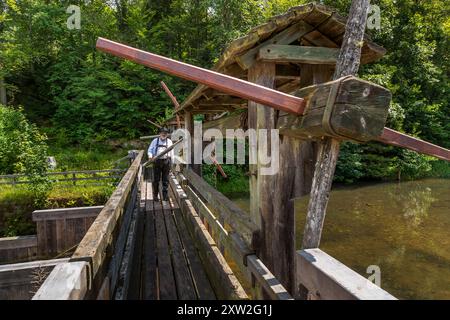 Raftsman Martin Spang from the Upper Nagold Valley Raftsmen's Guild at the Monhardter Wasserstube. It served as a dam to assist the raftsmen in floating timber. Streams were dammed to provide enough water to transport large quantities of timber from the Black Forest to distant areas on rafts. This mechanism was a central component of rafting, which was an important industry in the Black Forest for almost 500 years. Raftsman Martin Spreng. Altensteig, Baden-Württemberg, Germany Stock Photo