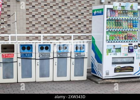 A vending machine in Japan with trash bins on the side Stock Photo