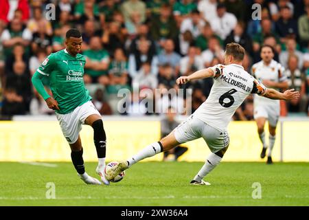 Plymouth Argyle's Morgan Whittaker and Hull City's Sean McLoughlin battle for the ball during the Sky Bet Championship match at Home Park, Plymouth. Picture date: Saturday August 17, 2024. Stock Photo