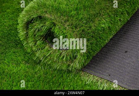 Rolled Artificial Grass Carpet on Display Stock Photo