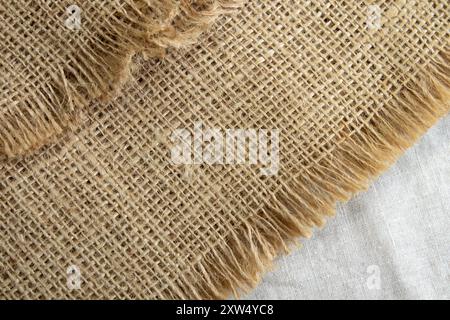Light beige or yellow natural texture of rough linen textile material background. Fabric canvas texture close up Stock Photo