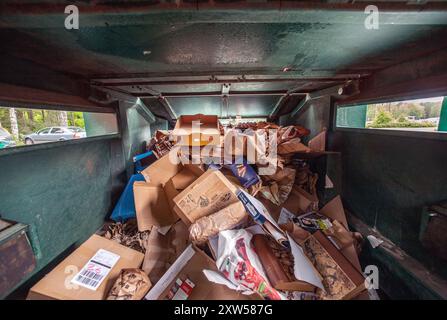 inside container for paper waste at the recycling station in Malmköping, Sweden Stock Photo