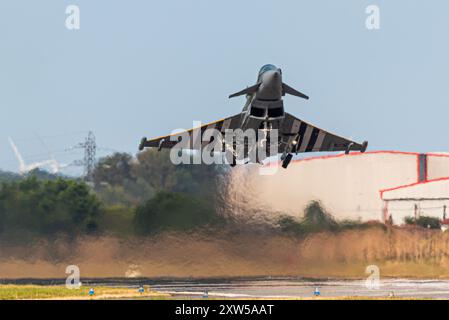 Royal Air Force Eurofighter Typhoon FGR 4 fighter jet plane taking off from London Southend Airport with hot jet efflux creating heat haze. Jelly air Stock Photo