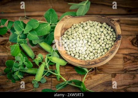 Peas Pisum sativum on olive wood for a pea  soup Stock Photo