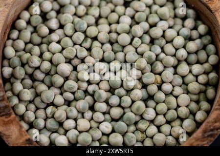 Peas Pisum sativum on olive wood for a pea  soup Stock Photo