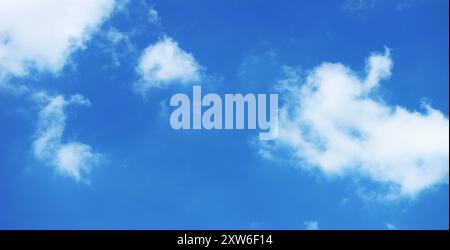 Pure White Clouds Floating on Vivid Blue Sky Stock Photo