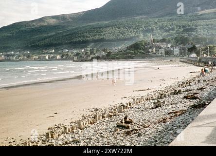 Sandy beach view to seaside resort town of Newcastle, County Down, Northern Ireland, late 1950s c 1960 Stock Photo