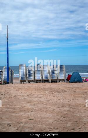 Scheveningen Beach in The Hague, Netherlands, is a popular seaside resort with a long sandy beach, a pier, and vibrant esplanade. It’s perfect for wat Stock Photo