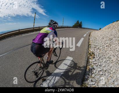 Female road cyclist riding up Mont Ventoux from Bedoin, Provence, France. Stock Photo