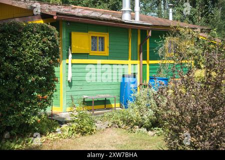 a small wooden cabin in the garden Stock Photo