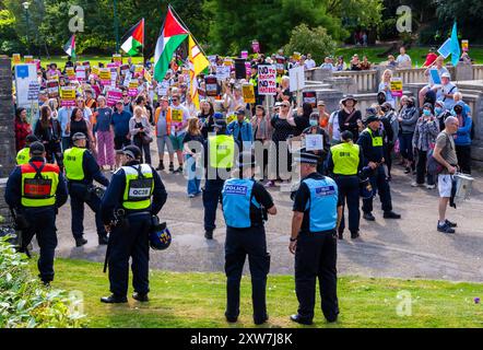 Bournemouth, Dorset, UK. 18th August 2024. Anti-immigration protestors hold 'Take Back Our Country' peaceful protest in Bournemouth. Counter-protestors organised their own protest at the same time in response to the far-right protest. Extra police resources from across the country have been brought in with police being given extra powers in light of violence and damage seen across the UK for similar protests and riots. Credit: Carolyn Jenkins/Alamy Live News Stock Photo