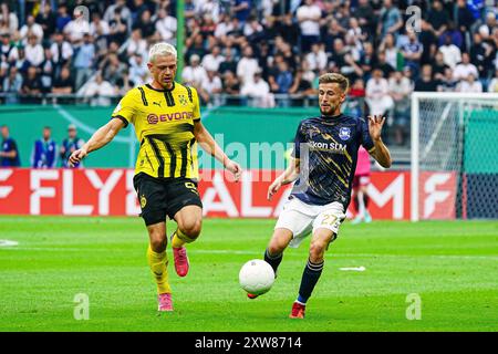 Julian Ryerson (Borussia Dortmund, #26), Corvin Bock (1. FC Phoenix Luebeck, #27)  GER, 1. FC Phoenix Luebeck vs. Borussia Dortmund, Fussball, DFB-Pokal, Runde 1, Saison 2024/2025, 17.08.2024  Foto: Eibner-Pressefoto/Marcel von Fehrn Stock Photo