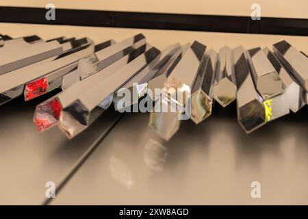 Light reflects off a collection of prism awards with varying geometric shapes, casting colorful reflections. Taken in Toronto, Canada. Stock Photo