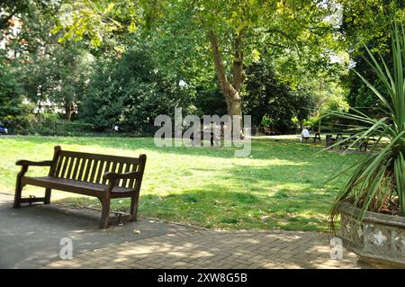 Shaded, grassy area, St John's Wood Church Grounds, St John's Wood, London, England, UK Stock Photo