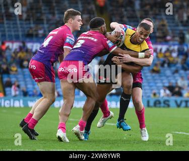 Corey Hall of Castleford Tigers is tackled by Olly Russell of Huddersfield Giants and Esan Marsters of Huddersfield Giants during the Magic Weekend match Huddersfield Giants vs Castleford Tigers at Elland Road, Leeds, United Kingdom, 18th August 2024  (Photo by Craig Thomas/News Images) Stock Photo