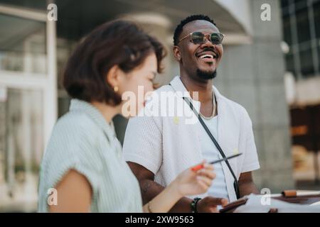 Multicultural startup business team having an outdoor meeting in an urban city area Stock Photo