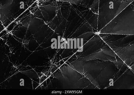 Old wrinkled texture of black crumpled old paper with worn scratches. Abstract grunge rough dark background for web page design and creative covers Stock Photo