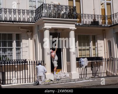 Painters and decorators working on Luxury housing  in Belgravia  London, UK. Stock Photo