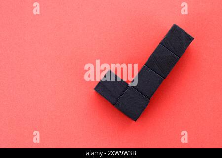 Check mark formed with wooden cubes Stock Photo