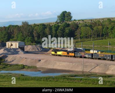 GB Railfreight class 60 diesel locomotive 60047 at Harrisons siding, Shap, Cumbria  with a freight train of box wagons stabled for the weekend Stock Photo