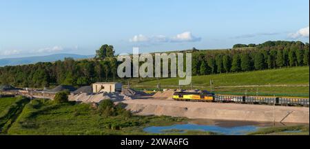 GB Railfreight class 60 diesel locomotive 60047 at Harrisons siding, Shap, Cumbria  with a freight train of box wagons stabled for the weekend Stock Photo