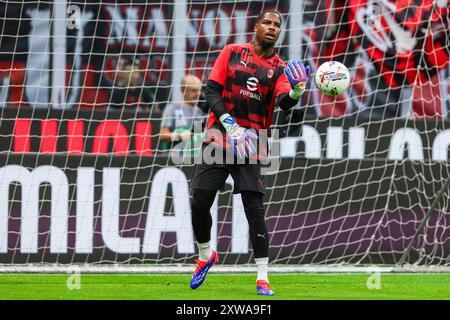 Milan, Italy. 17th Aug, 2024. Mike Maignan of AC Milan warms up during the Serie A 2024/25 football match between AC Milan and Torino FC at San Siro Stadium. Final score; Milan 2:2 Torino Credit: SOPA Images Limited/Alamy Live News Stock Photo