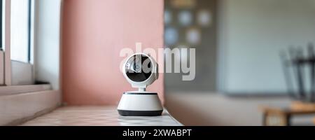 Ceiling mounted ed surveillance camera. A classroom with a camera mounted on the ceiling. CCTV system security or cctv camera on ceiling in apartment Stock Photo