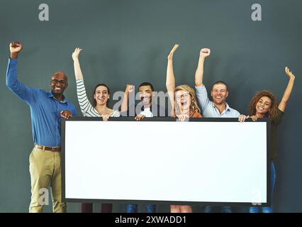 Business people, blank placard and group in portrait with smile, celebration and excited by wall in office. Men, women and happy with poster, banner Stock Photo