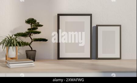 A close-up image of two pictures frame mockup, decorative plants, and books on a wooden table or console table against the white wall in a room. home Stock Photo