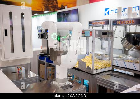 robotic arm preparing coffee in coffee shop Stock Photo