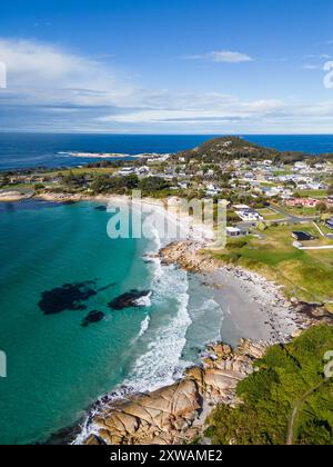 Bicheno, Tasmania: Aerial drone view of the beach at Bicheno coastline with a rainbow close to the famous Coles bay in Tasmania in Australia. Stock Photo