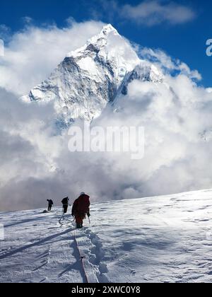 montage of three hikers on glacier and mount Everest, Mt Everest area
