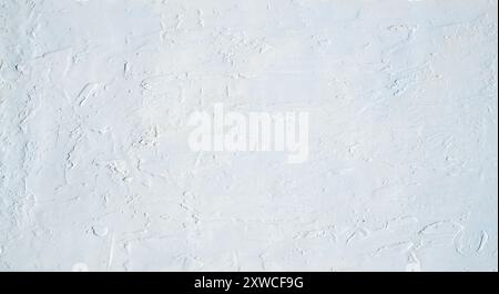 Background or actual image of a white textured plaster finish. A rough surface. Stock Photo