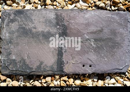 Background or actual image of a weathered Welsh roof slate from a Victorian house (UK) Stock Photo