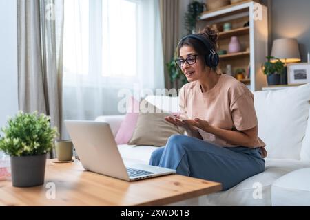 Emotional support. Young sick woman, or freshly divorced, relationship breakup, being fired from work, having video call on laptop computer with frien Stock Photo