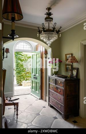 'Ball green' hall with limestone tiles in Wimbledon home, south-west London, England, UK. Stock Photo