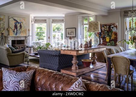 Open plan living and dining room with modern artwork in Wimbledon home, south-west London, England, UK. Stock Photo