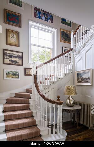 Edwardian staircase with barley twist spindles in Wimbledon home, south-west London, England, UK. Stock Photo