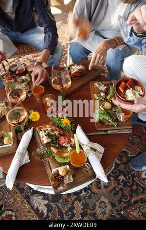 Swedish tapas enjoyed by friends at outdoor dinner Stock Photo