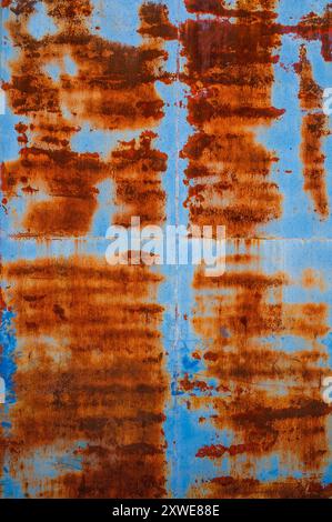 Rusty pattern on blue metal door Stock Photo
