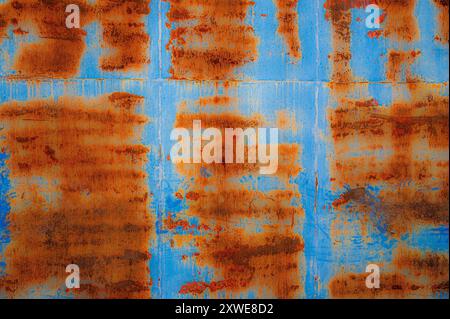 Rusty pattern on blue metal door Stock Photo