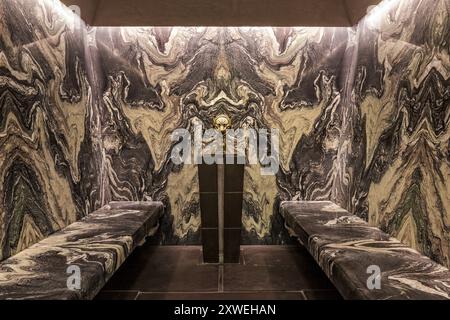 Patterned marble bench seating in luxury modern British home spa. London, UK Stock Photo