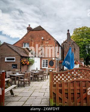 The Bat and Ball an 18th century pub known as the cradle of cricket stands opposite Broadhalfpenny Down on the Hambledon, Clanfield border. Stock Photo